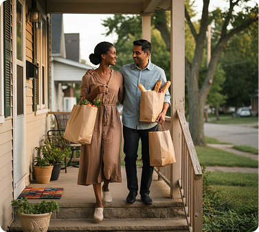 Couple walking together carrying grocery bags